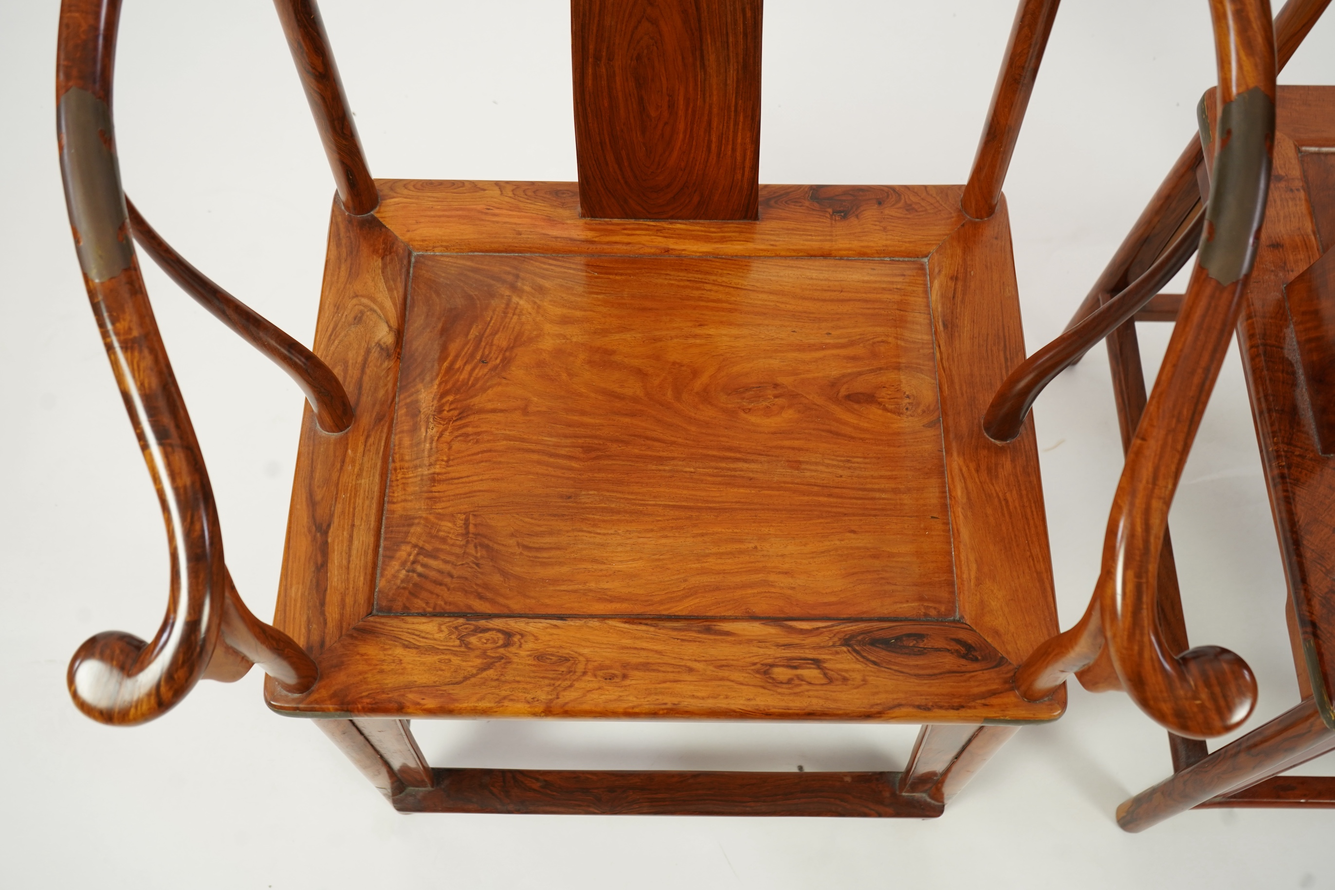 A pair of Chinese huanghuali and brass mounted horseshoe-back armchairs, quanyi, 19th century